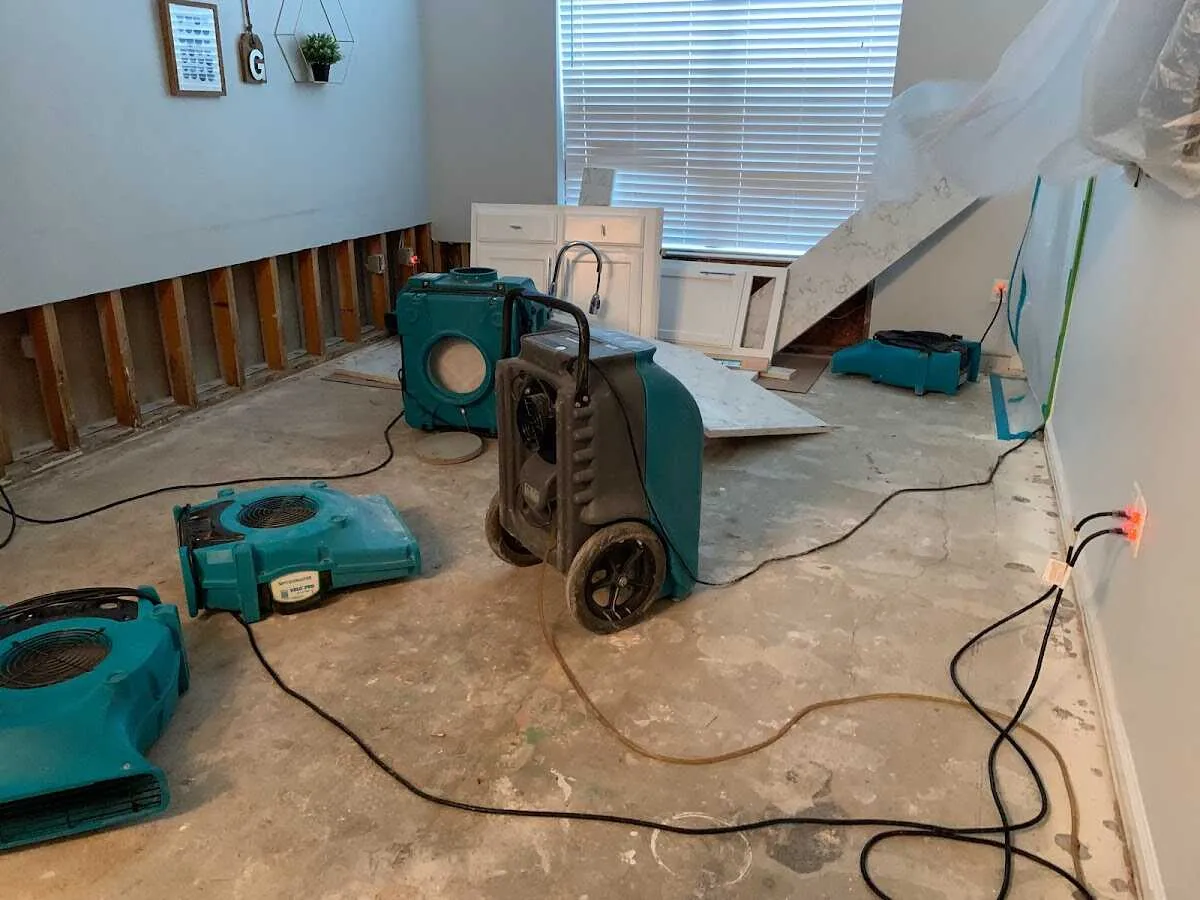 Dehumidifier in flood-cut room for Water Damage Restoration in De Witt